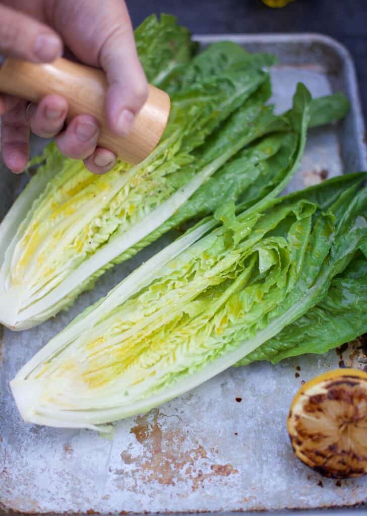 Raw romaine lettuce cut in half