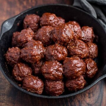 BBQ Meatballs with a Red Wine BBQ Sauce in a cast iron serving dish