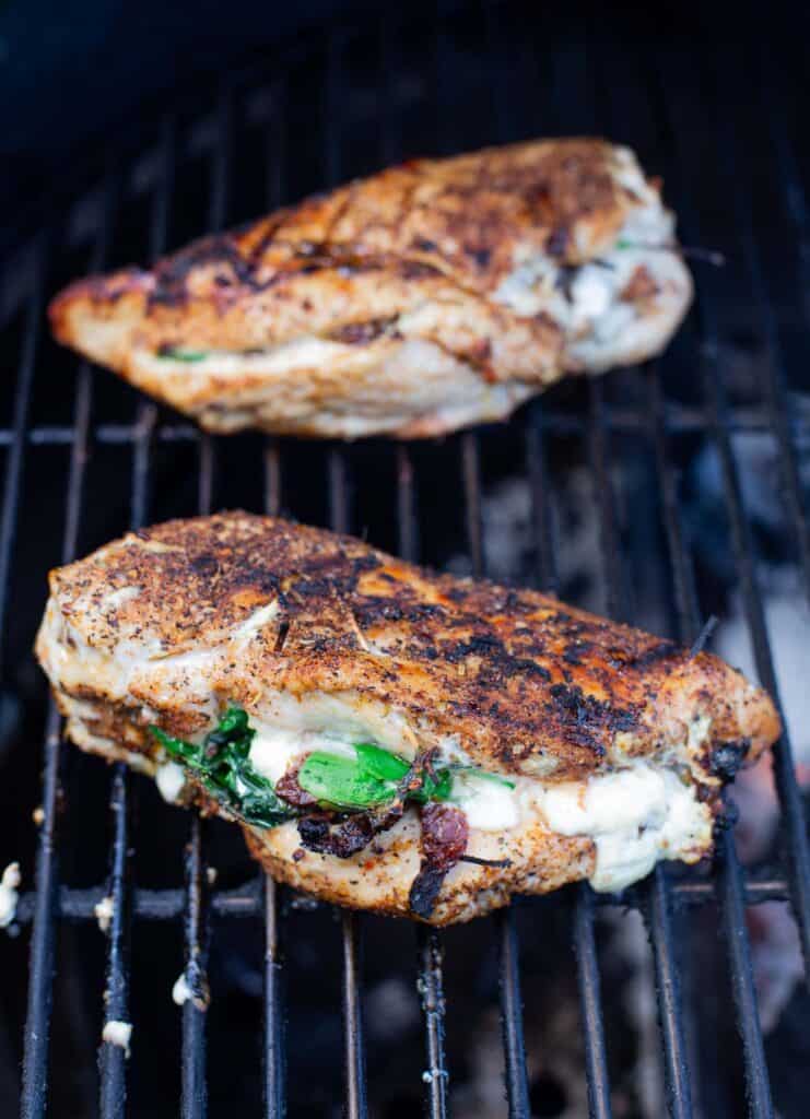 Stuffed Chicken Breasts on a grill cooking