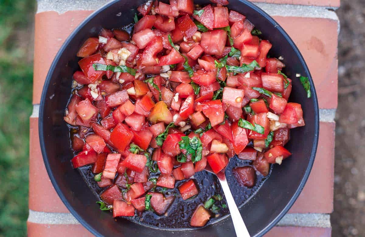 Tomatoes and basil in a serving bowl