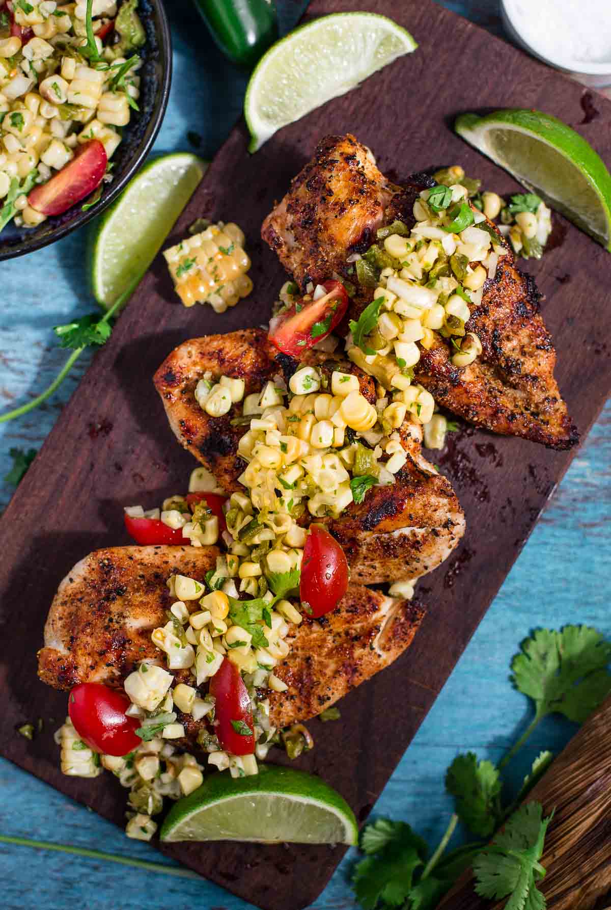 Grilled Chicken Breasts with Grilled Corn and Poblano Salsa on a serving platter
