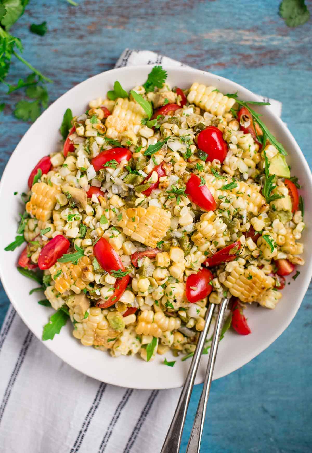 Grilled Corn and Poblano salad on a white platter