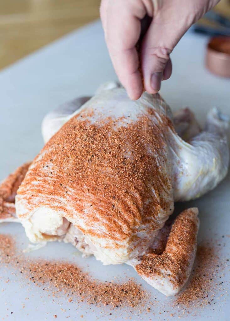 Seasoning a whole roaster chicken