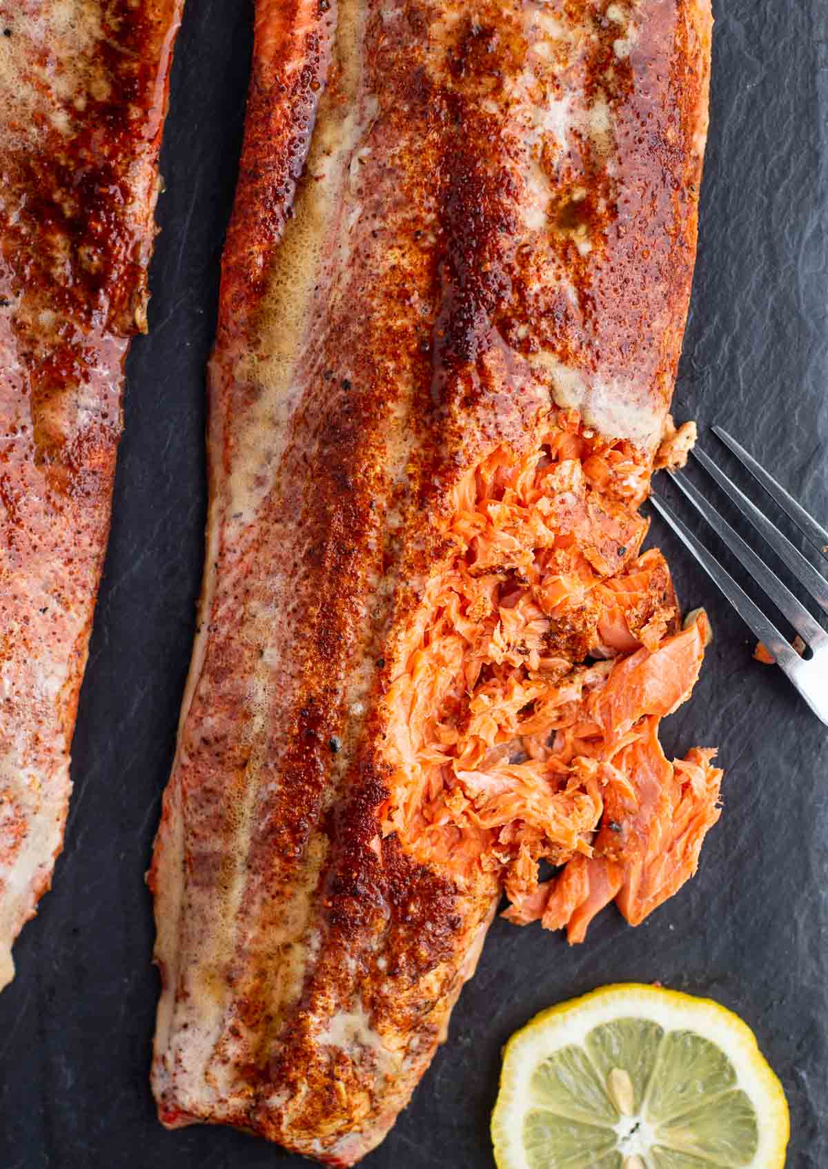 A closeup shot of tender flakes of juicy smoked Sockeye Salmon