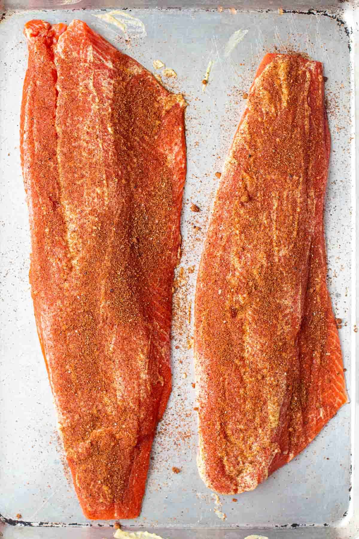 Two raw filets of Sockeye Salmon seasoned with Vindulge Salmon Seasoning