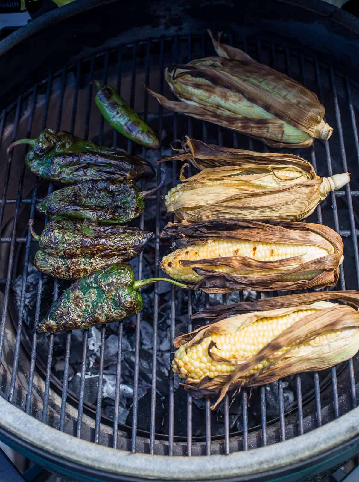 corn and poblano peppers cooking on the grill