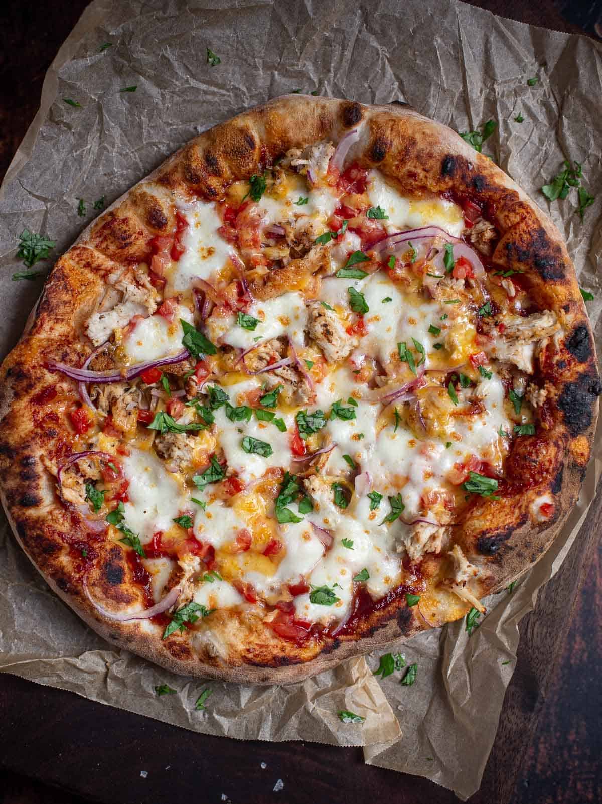 A Neapolitan Style BBQ Chicken Pizza on a serving platter