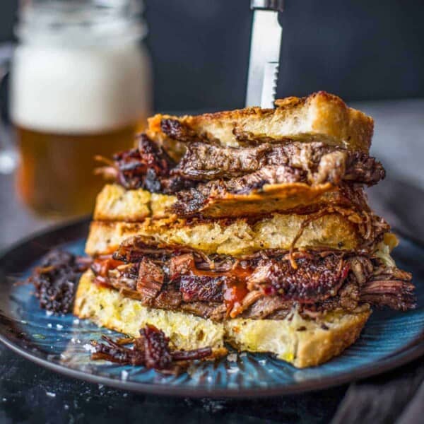 Two halve of Brisket Grilled Cheese Sandwich stacked on top of each other