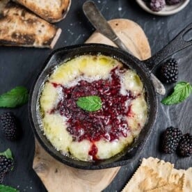 Grilled Brie Cheese with Blackberry Jam on a serving platter