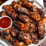 grilled chicken wings on a plate.