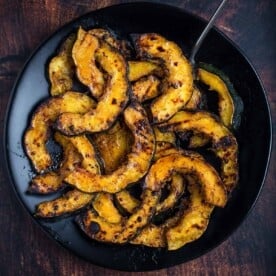 Grilled Acorn Squash with Maple Glaze on a serving dish