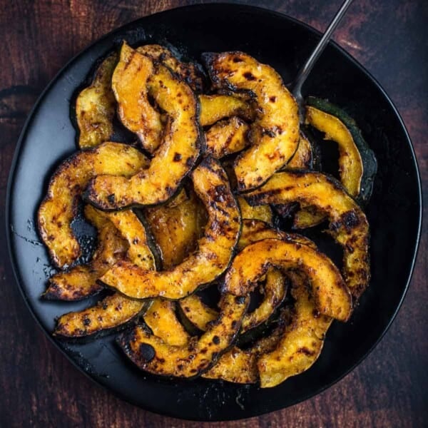 Grilled Acorn Squash with Maple Glaze on a serving dish