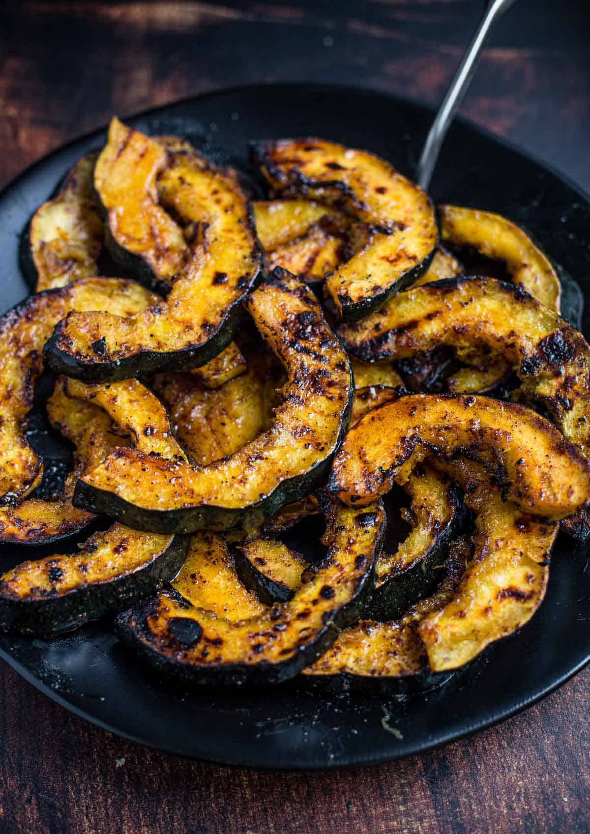 Grilled Acorn Squash with Maple Glaze on a serving dish