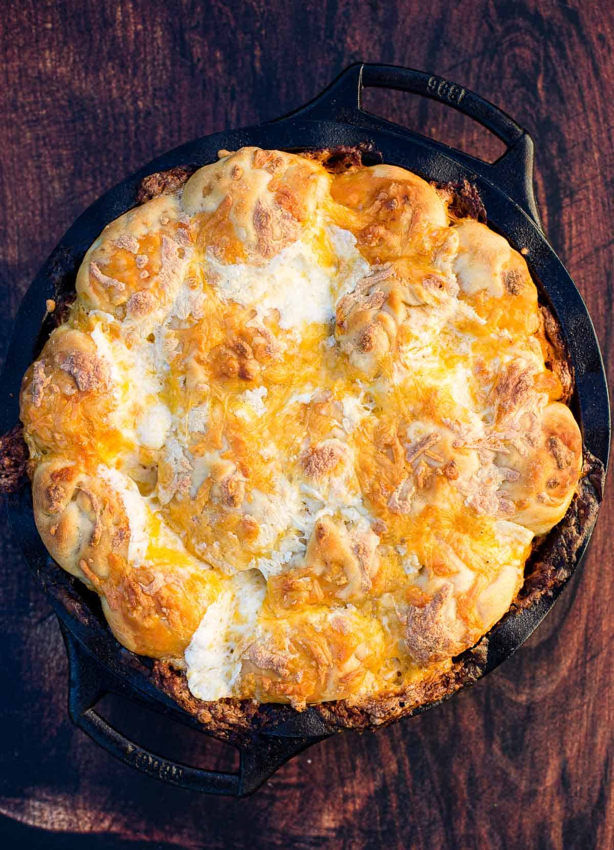 Easy Grilled Buffalo Chicken Pull Apart Bread in a cast iron pan