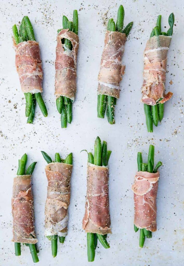 raw green beans wrapped in prosciutto