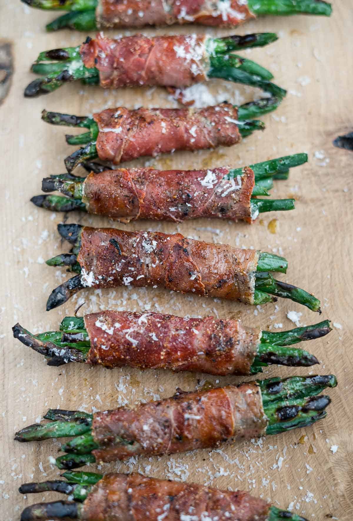 Prosciutto wrapped Grilled Green Bean Bundles on a serving platter