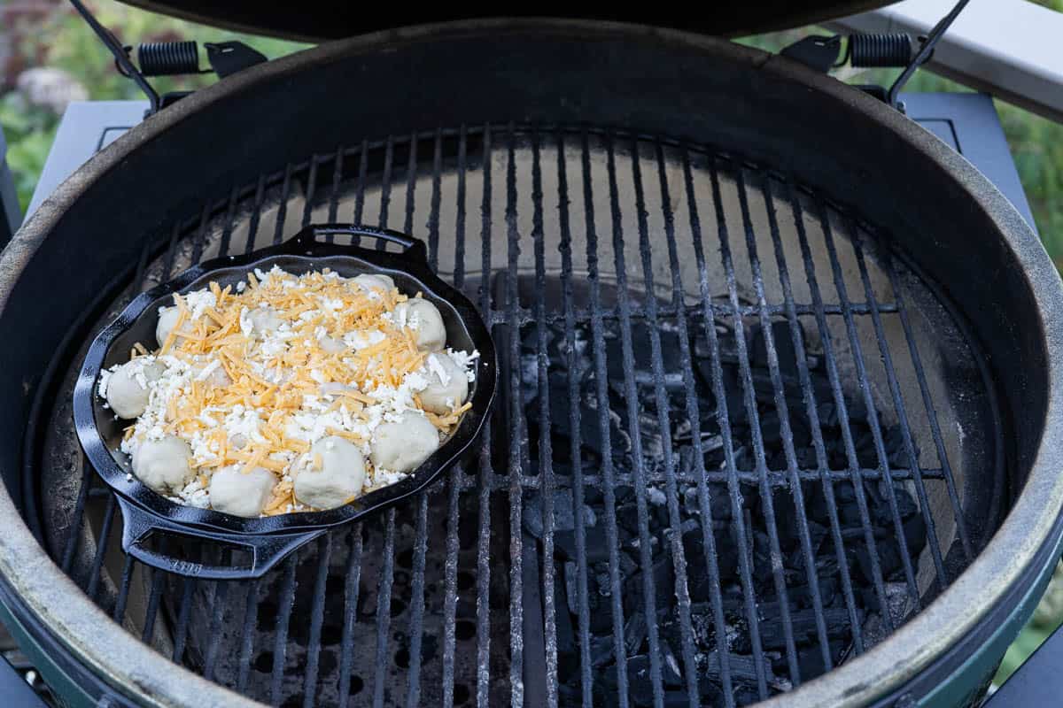 Easy Grilled Buffalo Chicken Pull Apart Bread cooking over indirect heat on the grill