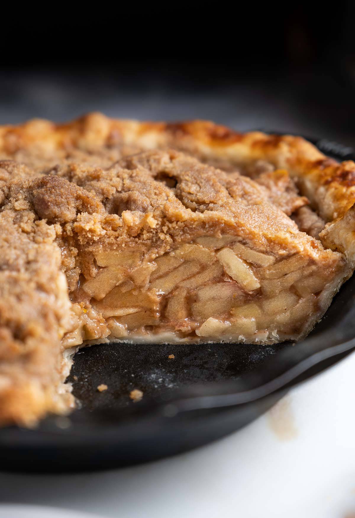Looking into the center of a grilled apple pie in a cast iron pie pan