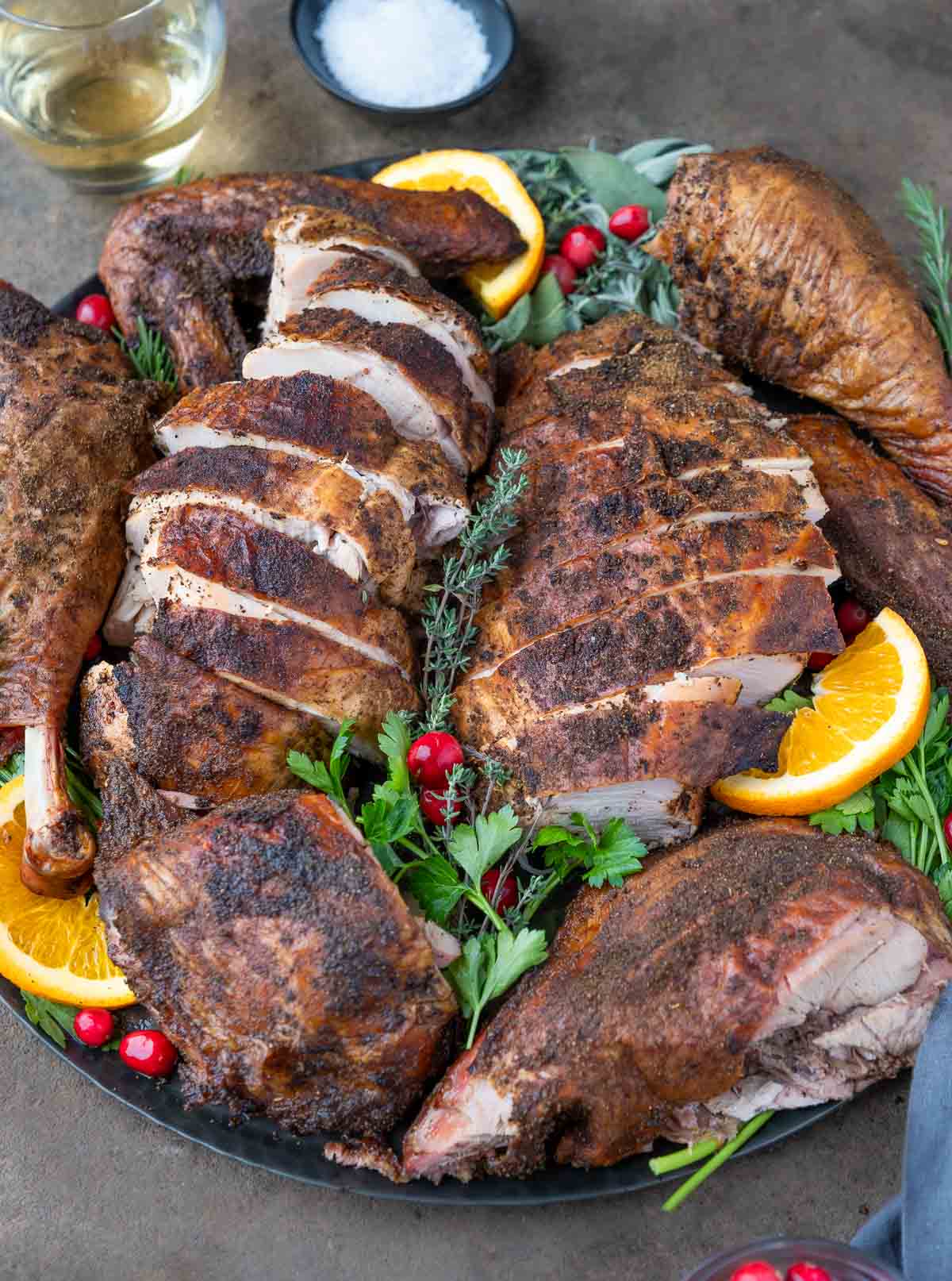 A Pellet Grilled Smoked Spatchcocked turkey carved and presented on a serving platter