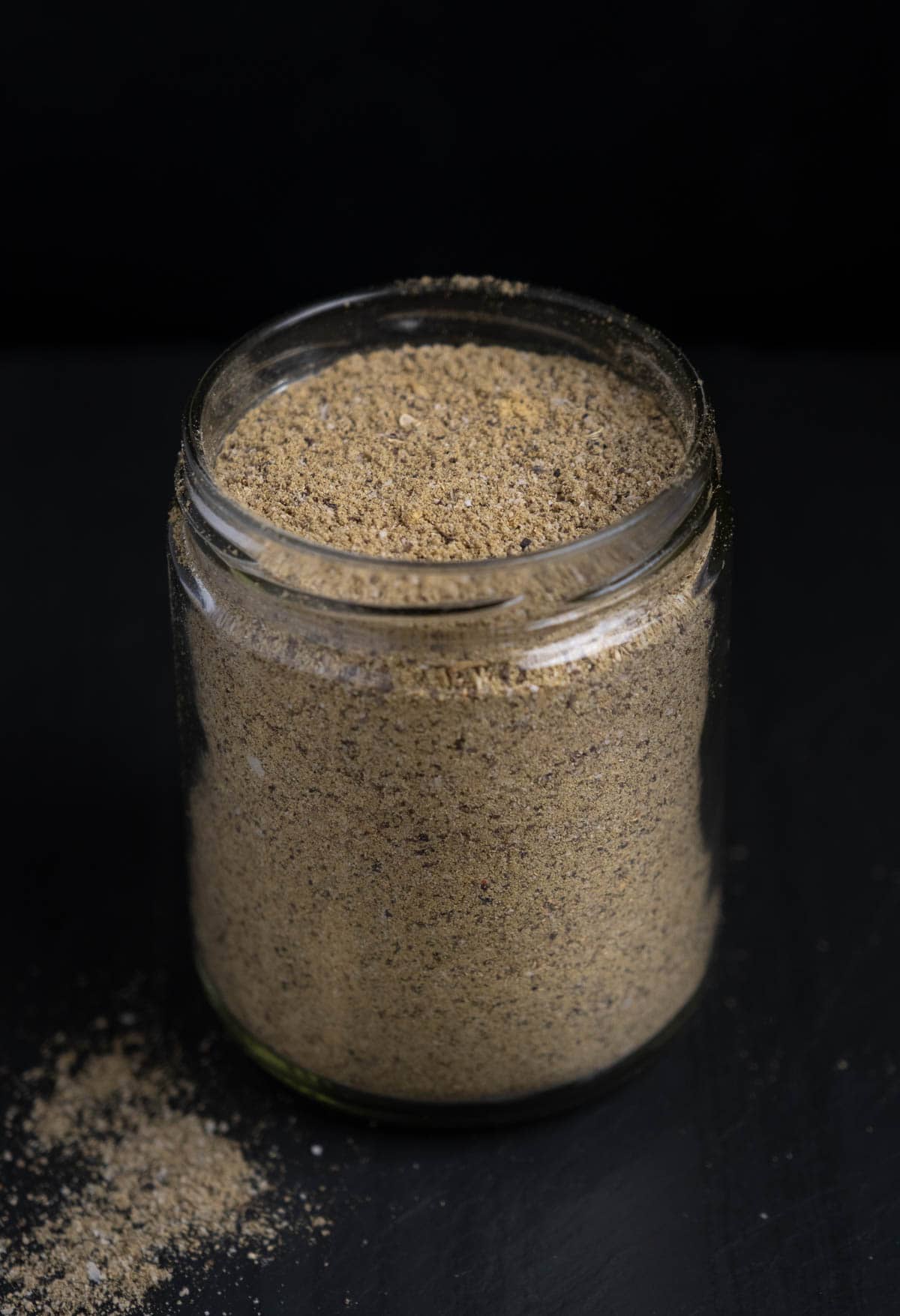 A mason jar with turkey seasoning is the perfect vessel for storing rub.