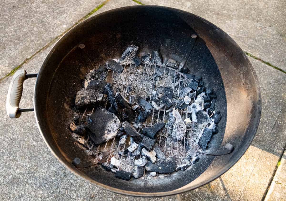 Weber kettle grill with leftover charcoal prior to cleaning.