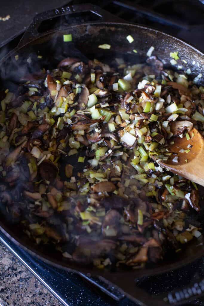 sautéing vegetables in a cast iron skillet