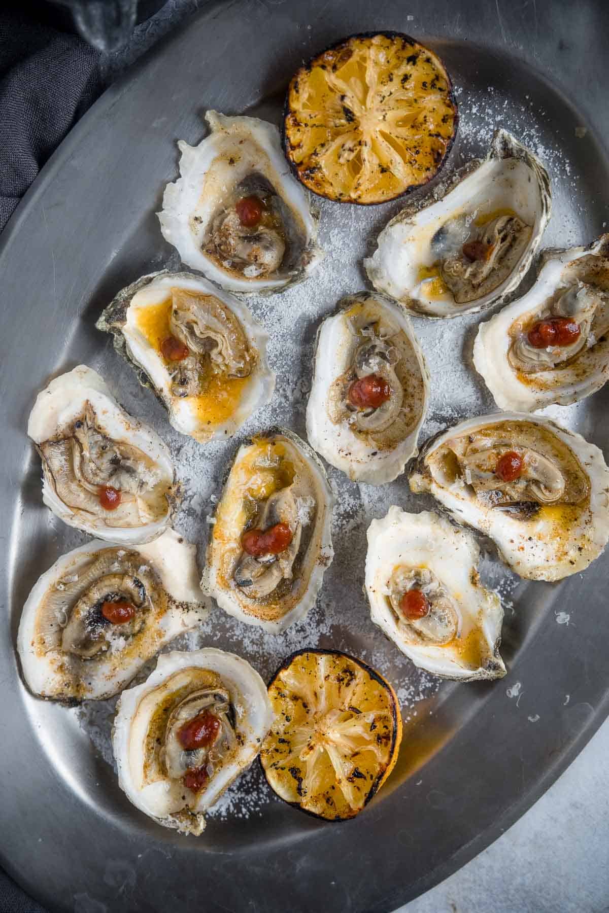 Oysters on the half shell with grilled lemon.