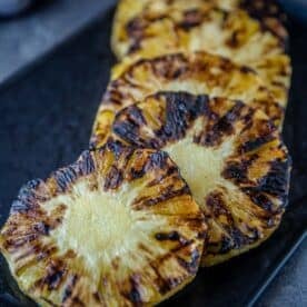 Grilled Pineapple slices on a serving dish