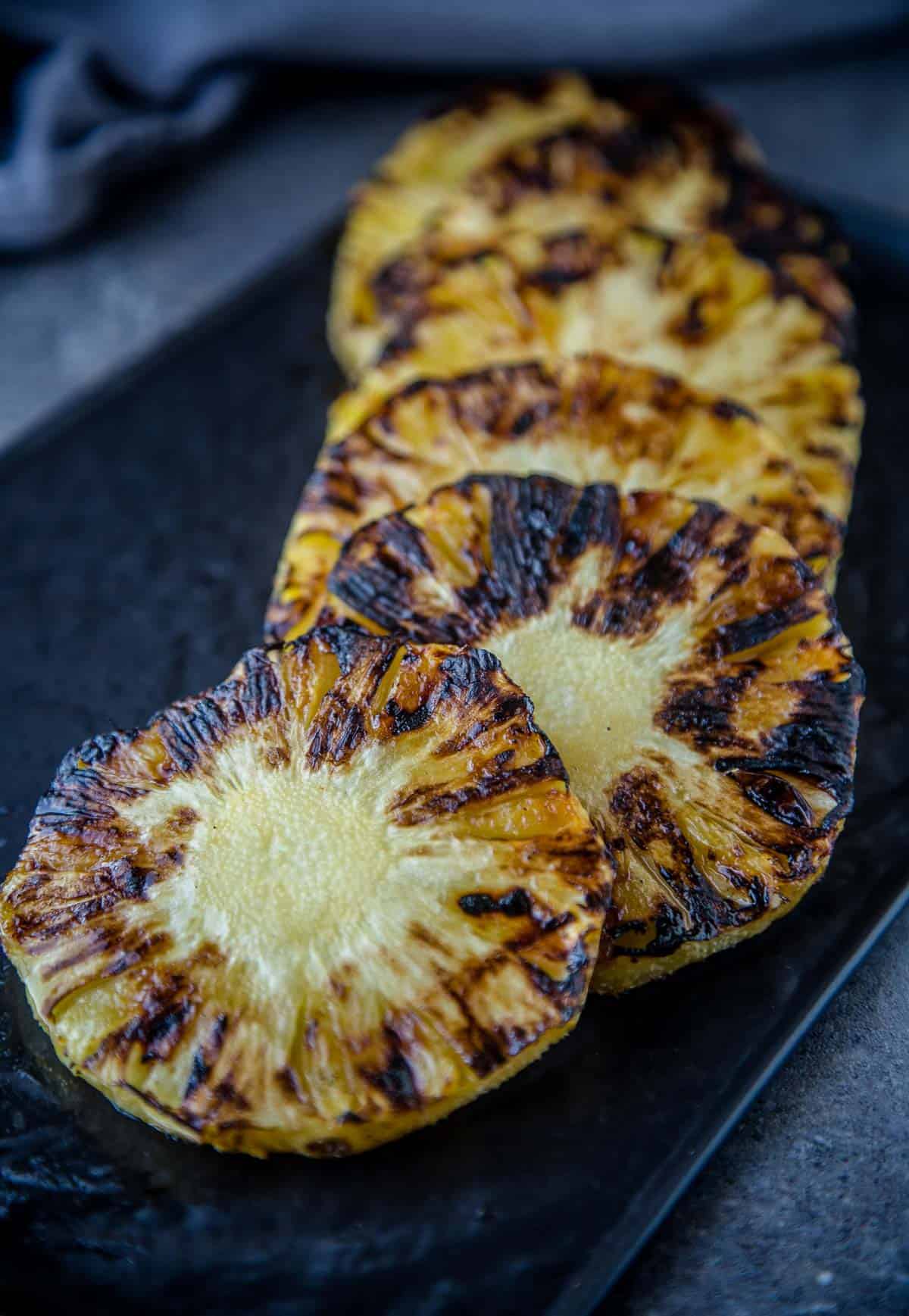Grilled Pineapple slices on a serving platter