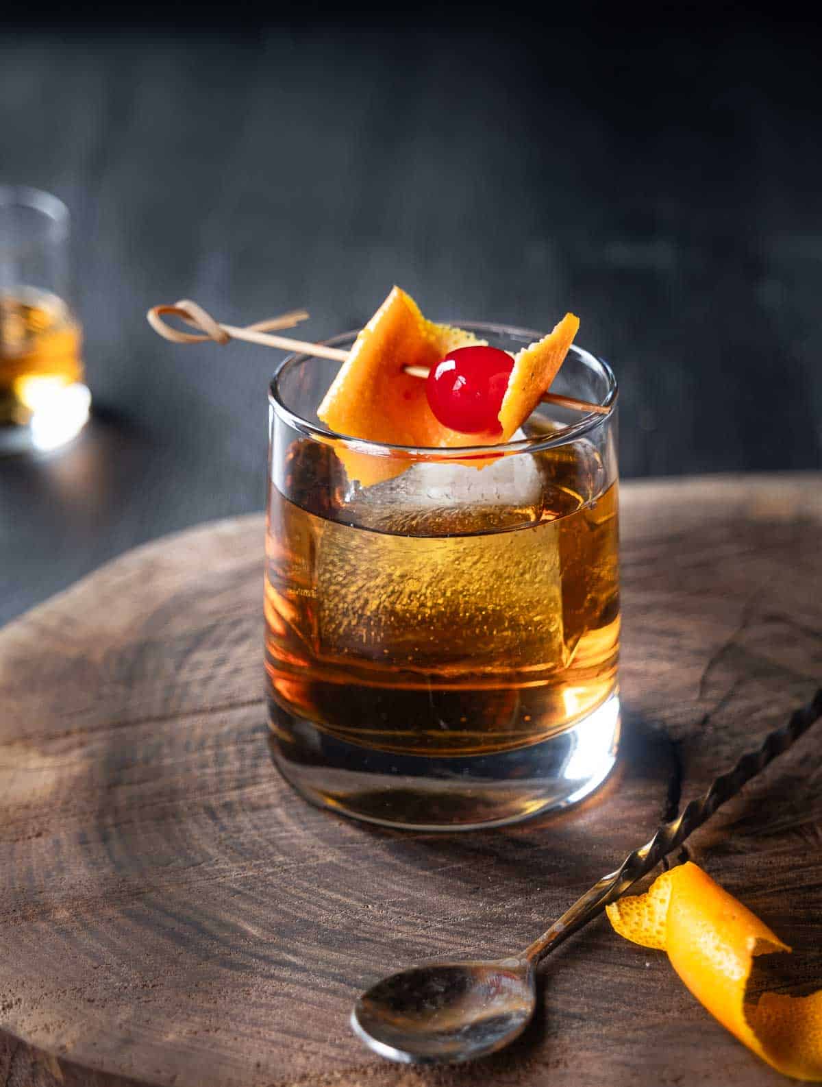 A smoky old fashioned in a rocks glass