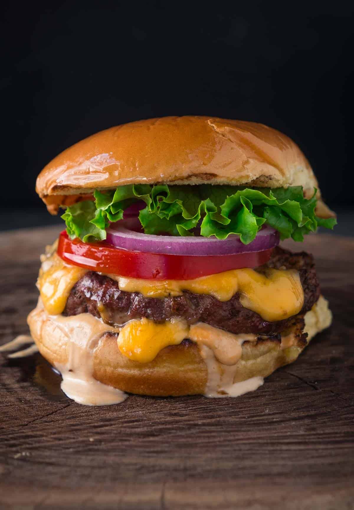 Smoked cheeseburger on a wood board