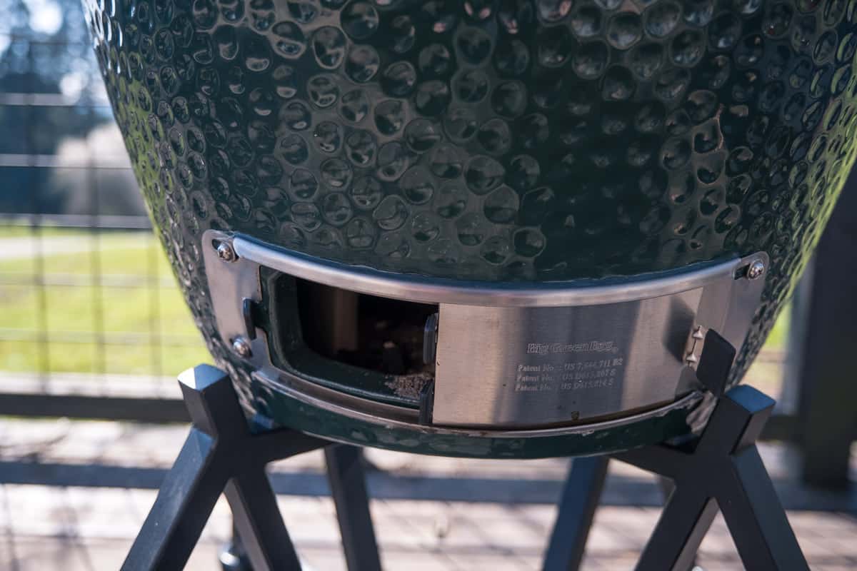 The bottom vent open on a Large Big Green Egg where the air comes into the EGG.