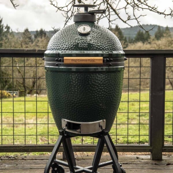 Large Big Green Egg on a deck closed.