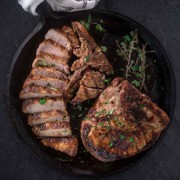 Grilled pork steaks on a serving platter