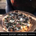 Mary from Vindulge holding a kale and mushroom pizza on a wooden pizza peel in the sunset.