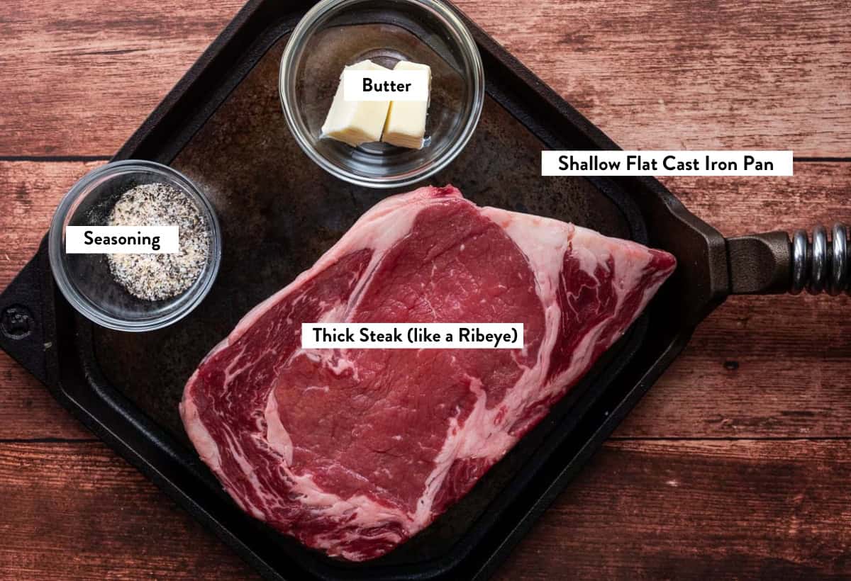 Ingredient photo of steak, butter, and seasoning for grilling steak in a pizza oven.