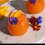 A pinterest pin with the title Recipe, Aperol Spritz Slushie and two slushies in stemless wine glasses.