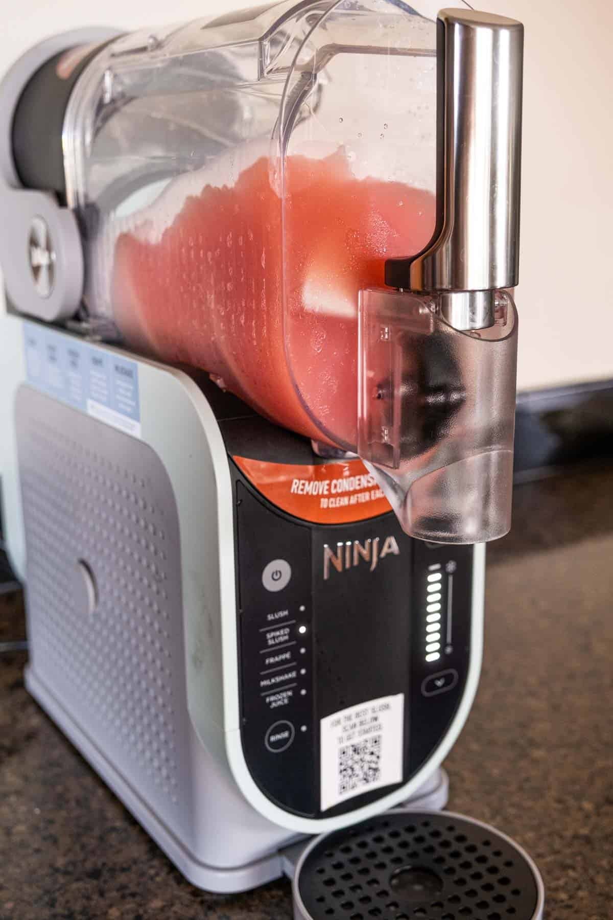 A rosé wine slushy being made in a Ninja Slushi Machine.