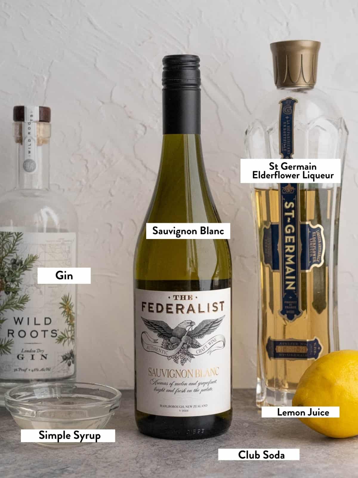Ingredients for a Kiwi 77 Sauvignon Blanc slushie with text overlay titles. 