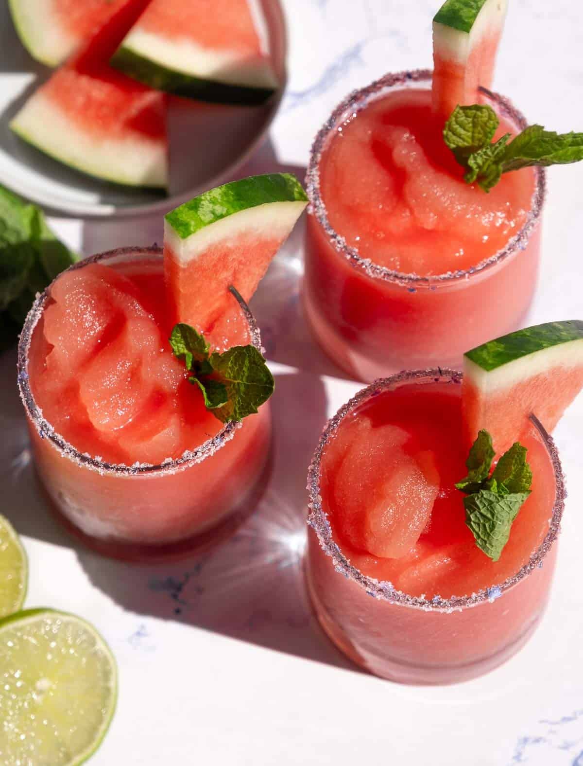 Three Watermelon Frosé Slushies on a table. 
