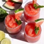 Three glasses filled with Watermelon Frosé Slushies.