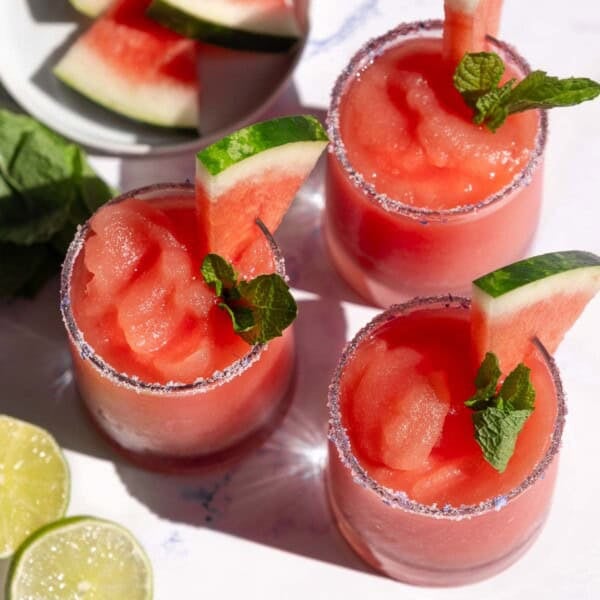 Three glasses filled with Watermelon Frosé Slushies.