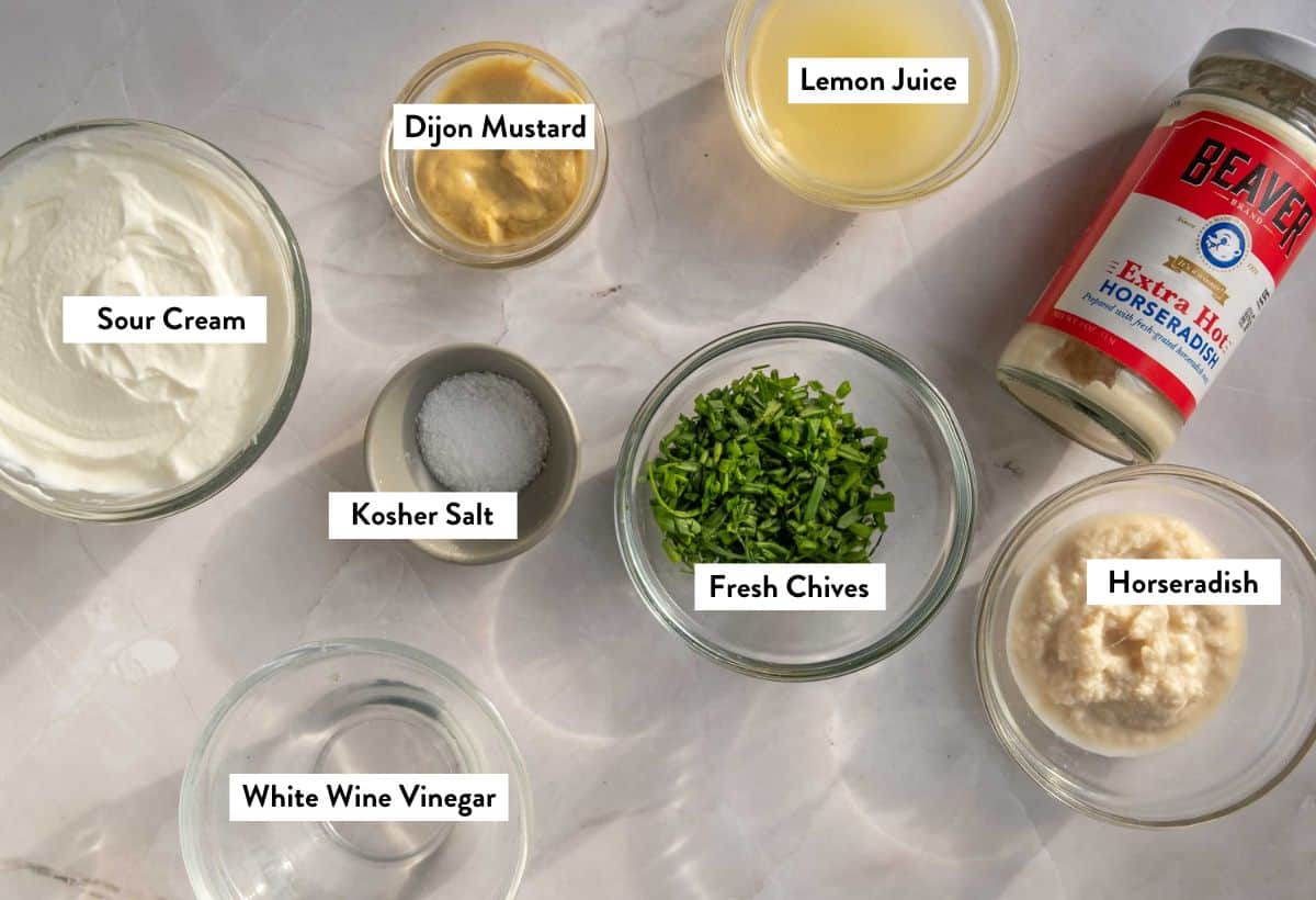 Ingredients for creamy horseradish sauce in small bowls overlayed with titles. 